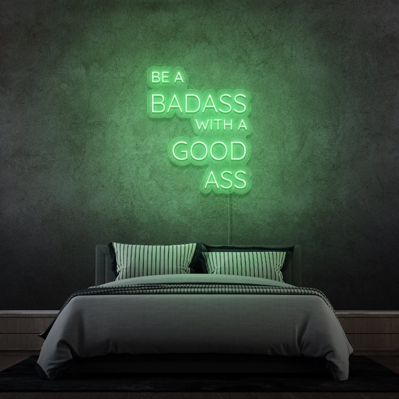 „BE A BADASS WITH A GOOD ASS“ – LED-Neonschild