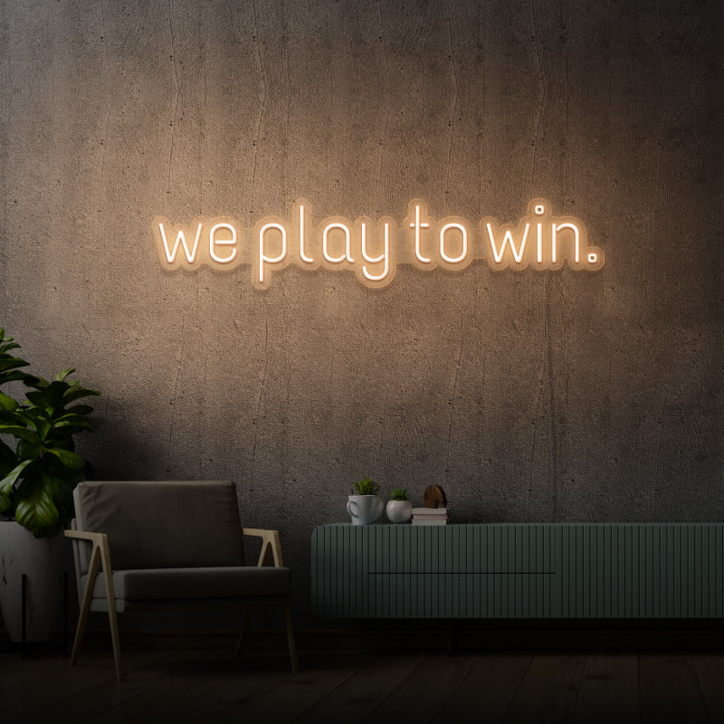 „WE PLAY TO WIN“ – LED-Neonschild
