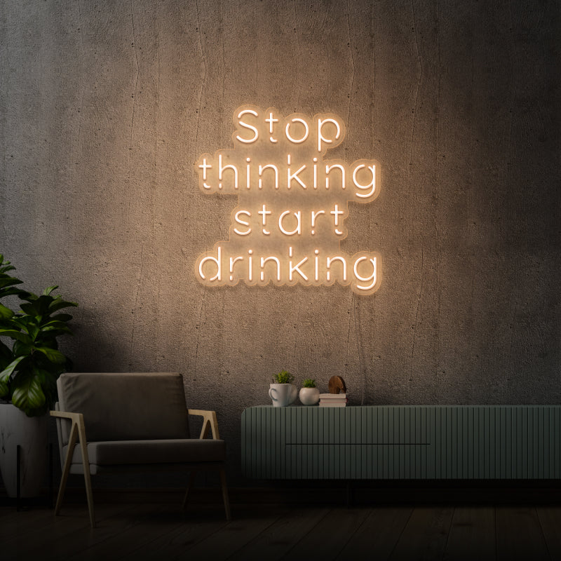 'STOP THINKING START DRINKING' - segnaletica a LED al neon